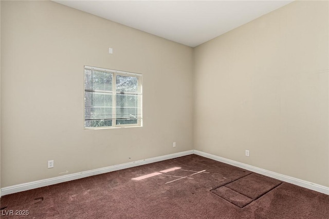 spare room with carpet floors and baseboards