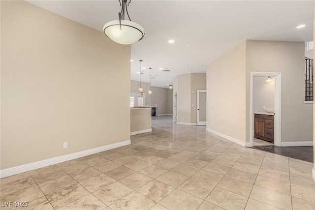 unfurnished room featuring recessed lighting, light tile patterned flooring, and baseboards