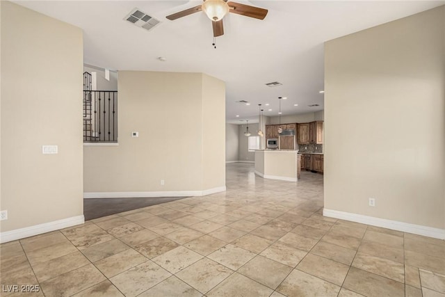 spare room with a ceiling fan, recessed lighting, visible vents, and baseboards