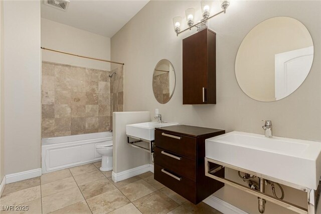 bathroom with visible vents, bathing tub / shower combination, toilet, tile patterned floors, and a chandelier