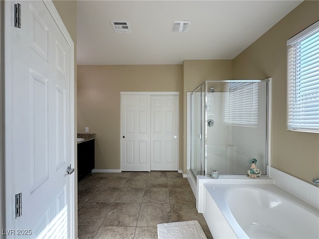 bathroom with tile patterned flooring, visible vents, baseboards, a shower stall, and a bath