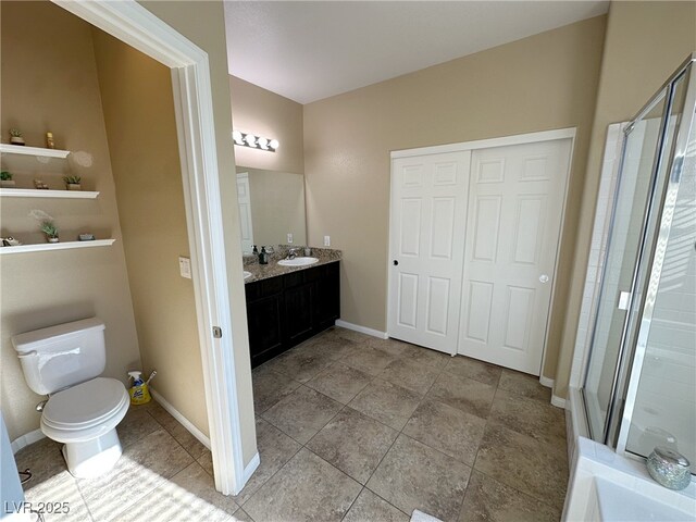 full bath with baseboards, a shower stall, toilet, and vanity