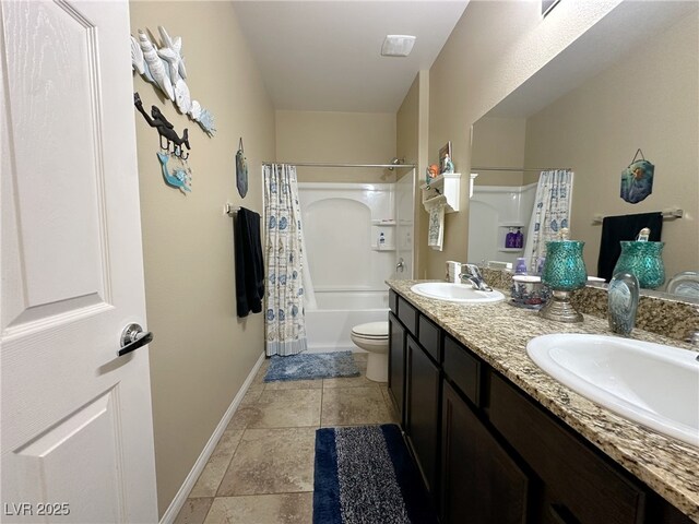 full bathroom with shower / bath combination with curtain, a sink, toilet, and baseboards