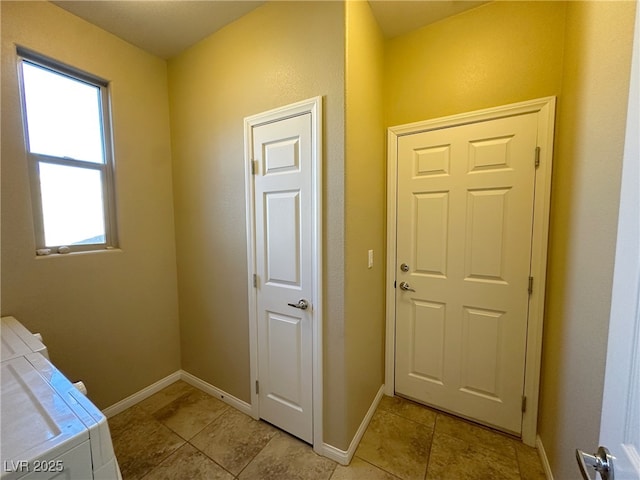 doorway to outside featuring baseboards