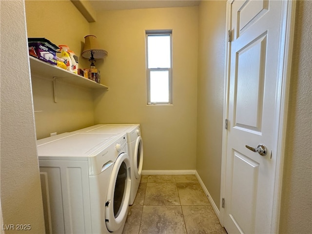 laundry area with laundry area, independent washer and dryer, and baseboards