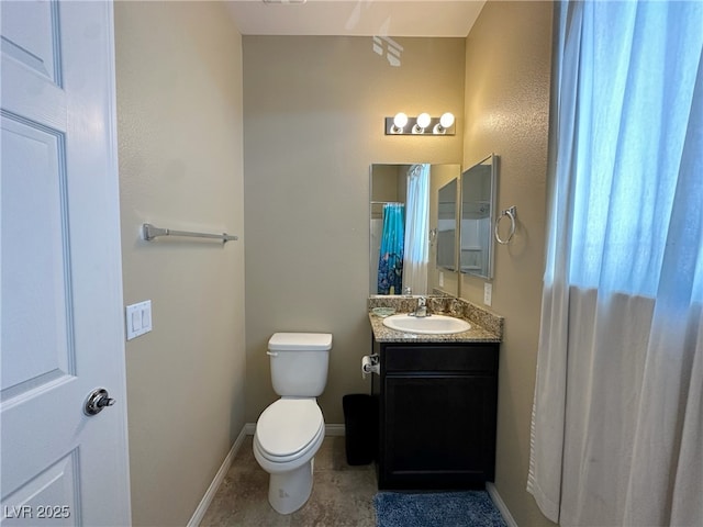 bathroom with tile patterned floors, vanity, toilet, and baseboards