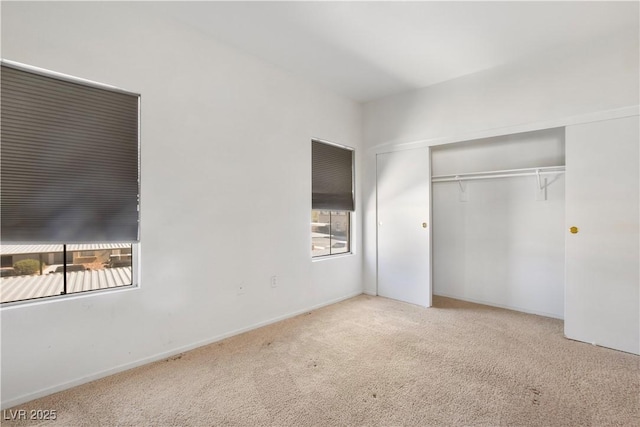 unfurnished bedroom featuring a closet and carpet