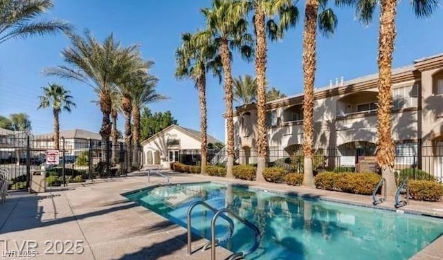 pool featuring a residential view and fence