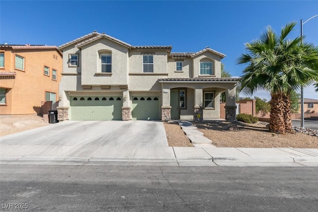 mediterranean / spanish-style house with an attached garage, stucco siding, driveway, and stone siding
