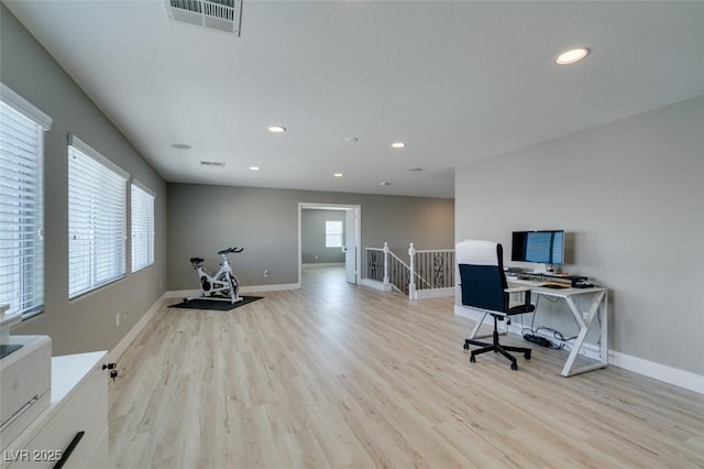 office space with light wood-style flooring, recessed lighting, visible vents, and baseboards