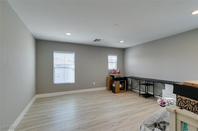 home office with recessed lighting, light wood-type flooring, and baseboards