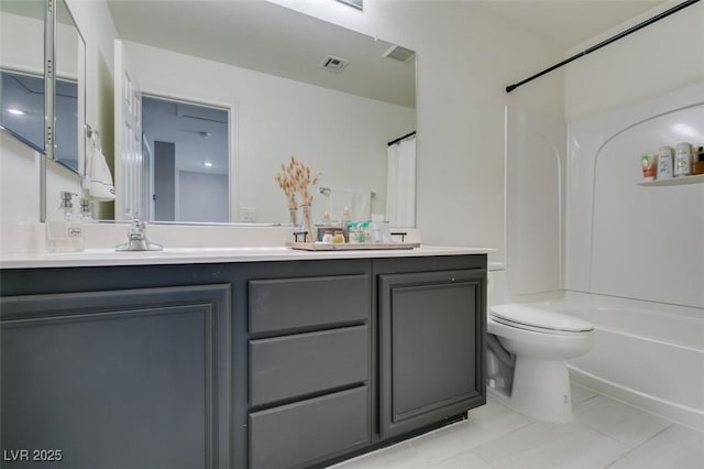 full bathroom featuring toilet, vanity, tile patterned flooring, and shower / bath combo