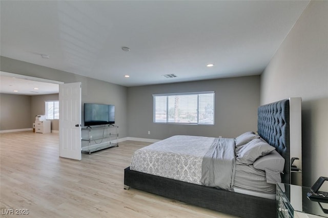 bedroom featuring light wood-style floors, recessed lighting, visible vents, and baseboards