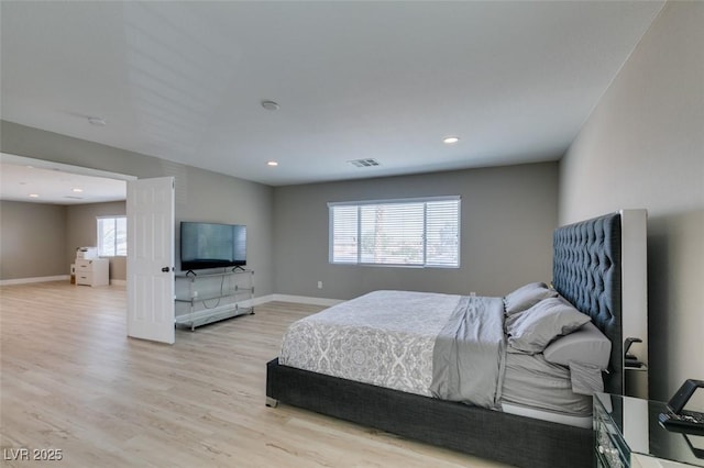 bedroom featuring light wood-style floors, baseboards, and recessed lighting