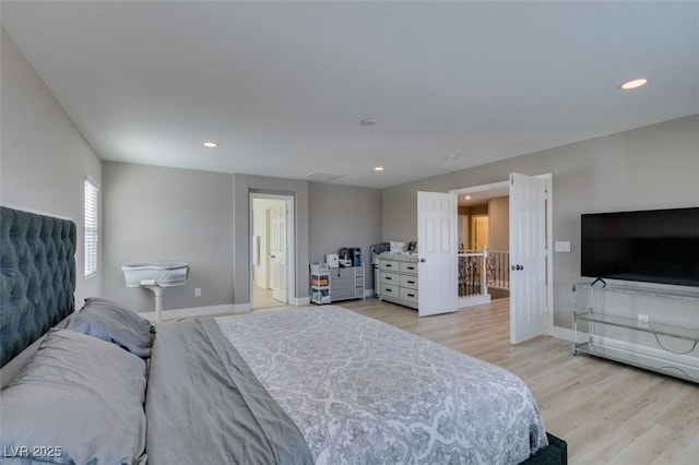 bedroom featuring baseboards, light wood-type flooring, and recessed lighting