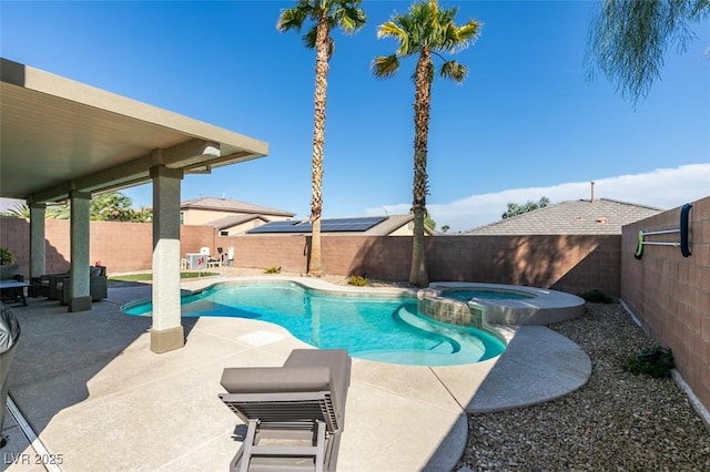 view of swimming pool featuring a patio area, a fenced backyard, and a pool with connected hot tub