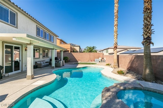 view of swimming pool with an outdoor living space, a fenced backyard, a patio, and a pool with connected hot tub