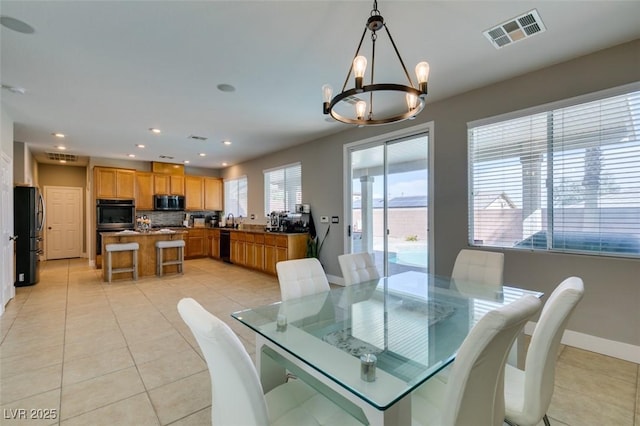 dining space with a notable chandelier, light tile patterned floors, recessed lighting, visible vents, and baseboards