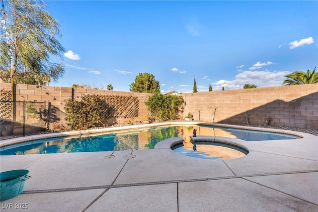 view of swimming pool with an in ground hot tub, a fenced backyard, and a fenced in pool