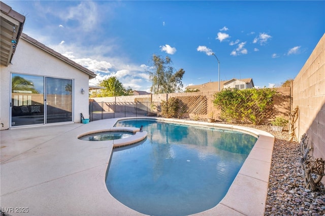 view of pool with a patio area, a fenced backyard, and a pool with connected hot tub