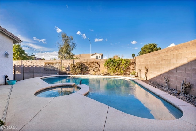 view of swimming pool with a pool with connected hot tub and a fenced backyard