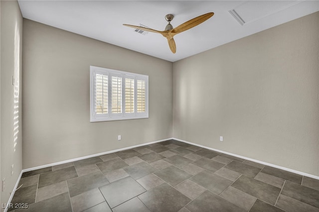 unfurnished room with baseboards, visible vents, and a ceiling fan