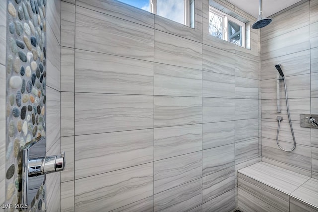 bathroom featuring tiled shower