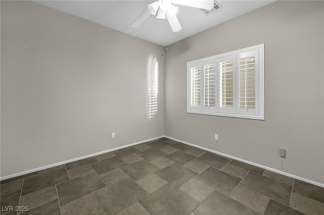 unfurnished room featuring baseboards, visible vents, and ceiling fan