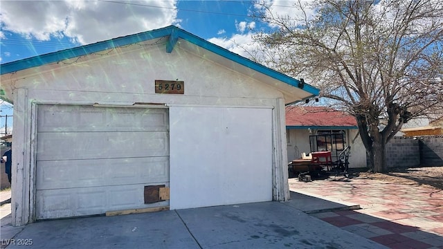 detached garage with fence