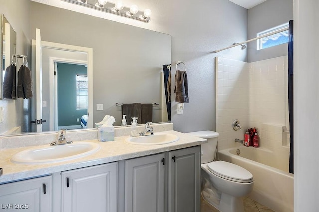 full bath featuring double vanity, toilet, shower / bathtub combination, and a sink