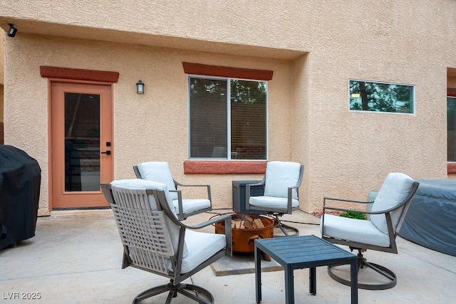 view of patio / terrace featuring area for grilling and an outdoor fire pit