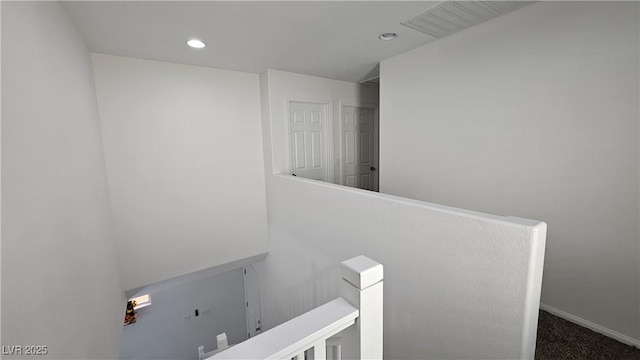 bathroom featuring baseboards and recessed lighting