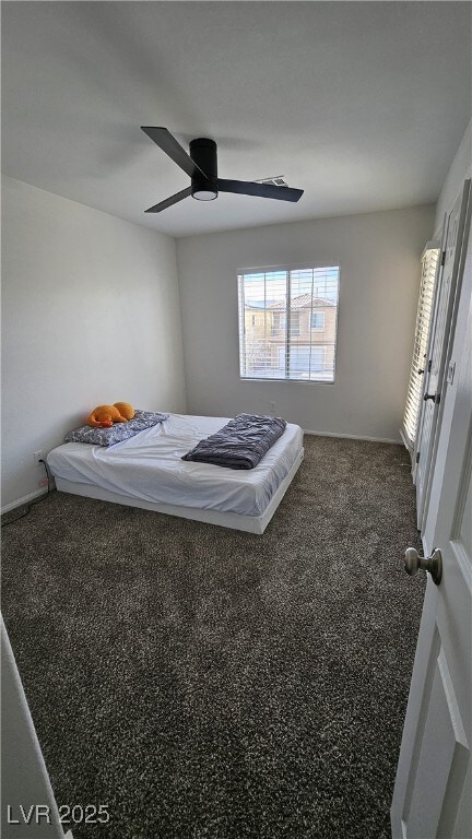 carpeted bedroom with ceiling fan