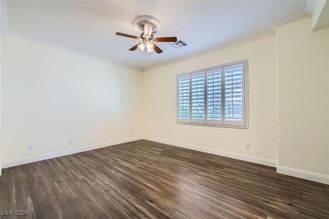 spare room featuring ceiling fan, visible vents, dark wood finished floors, and crown molding