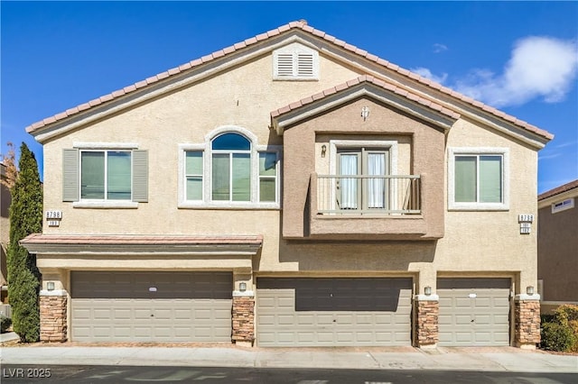 multi unit property with a tile roof, a garage, stucco siding, and stone siding