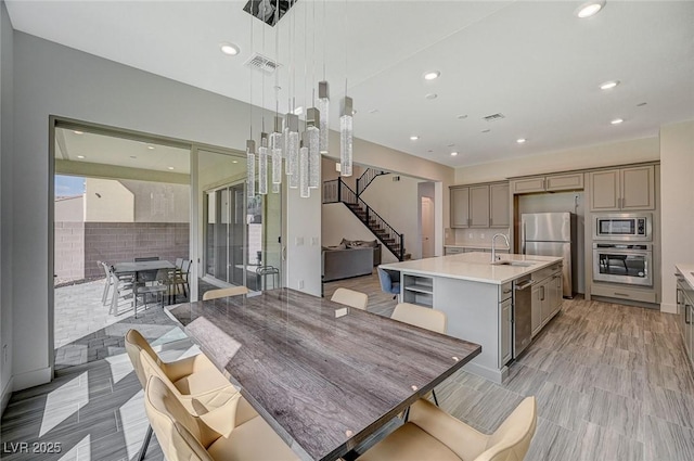 dining space with stairway, visible vents, and recessed lighting