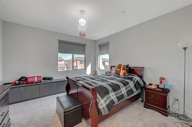 bedroom with light colored carpet