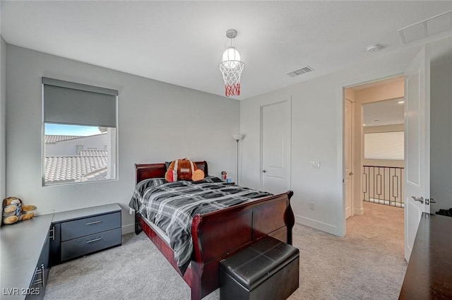 bedroom featuring light carpet, visible vents, and baseboards