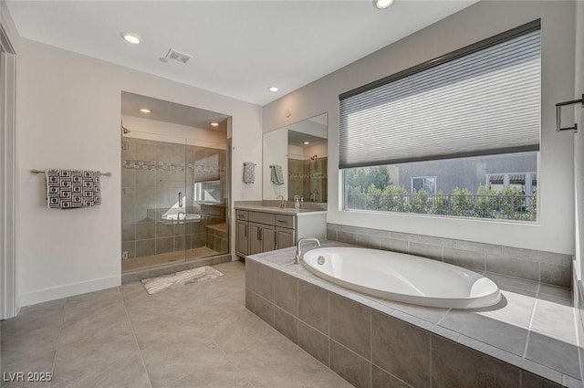 bathroom with visible vents, a shower stall, vanity, baseboards, and a bath