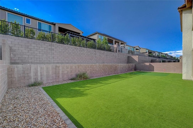 view of yard with a fenced backyard