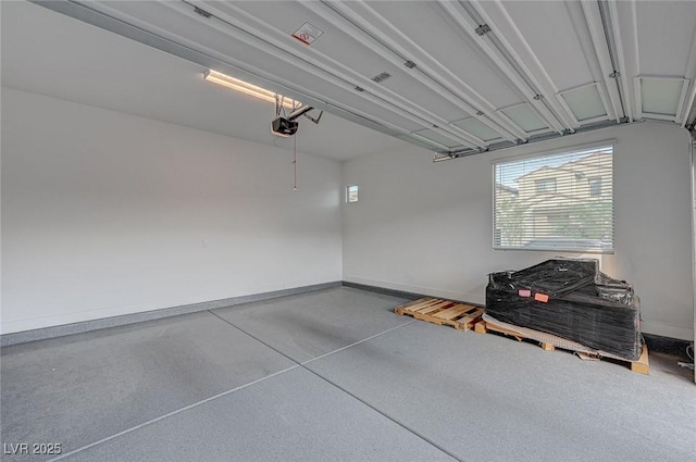 garage featuring baseboards and a garage door opener