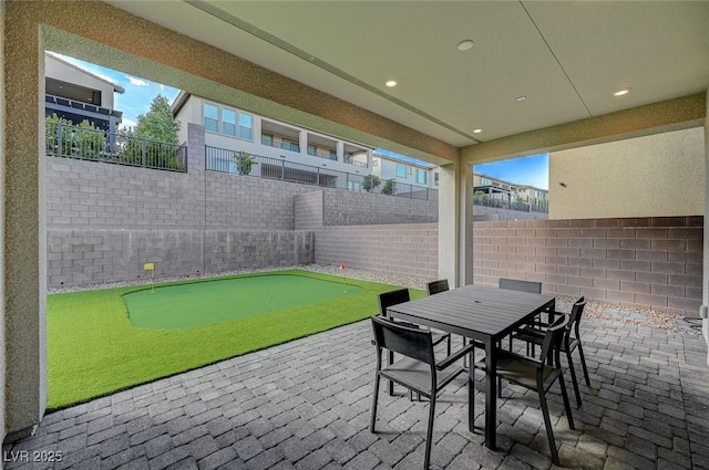 view of patio featuring outdoor dining space and a fenced backyard