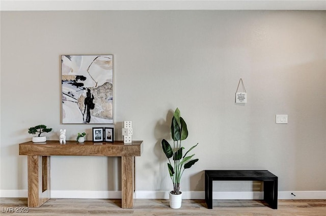 room details featuring baseboards and wood finished floors