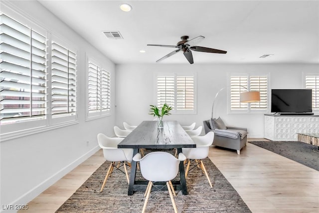 dining room with light wood-type flooring, visible vents, a ceiling fan, recessed lighting, and baseboards