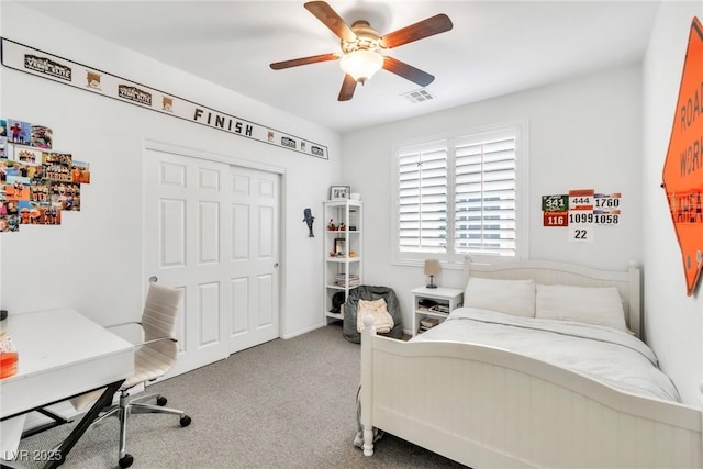 bedroom featuring visible vents, carpet flooring, and a ceiling fan