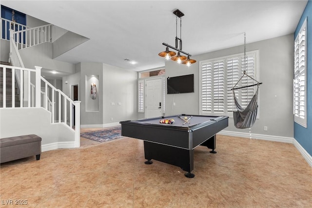 game room featuring pool table and baseboards