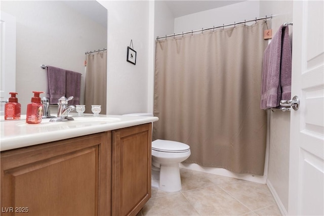 bathroom with vanity, tile patterned flooring, and toilet