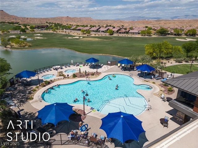 birds eye view of property with golf course view and a water and mountain view