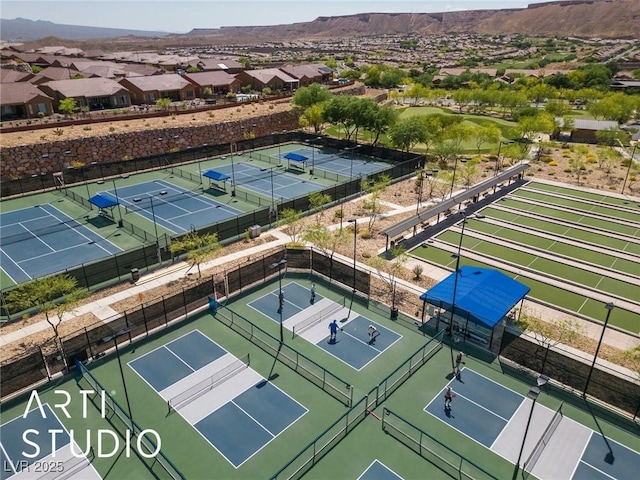 birds eye view of property with a residential view