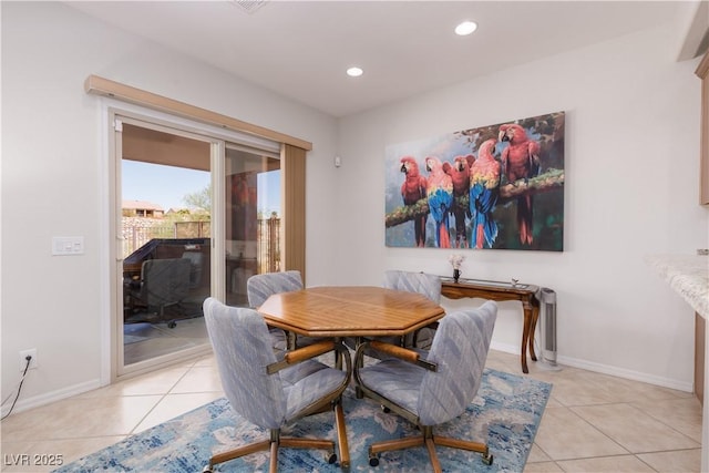 dining room with recessed lighting, light tile patterned flooring, and baseboards